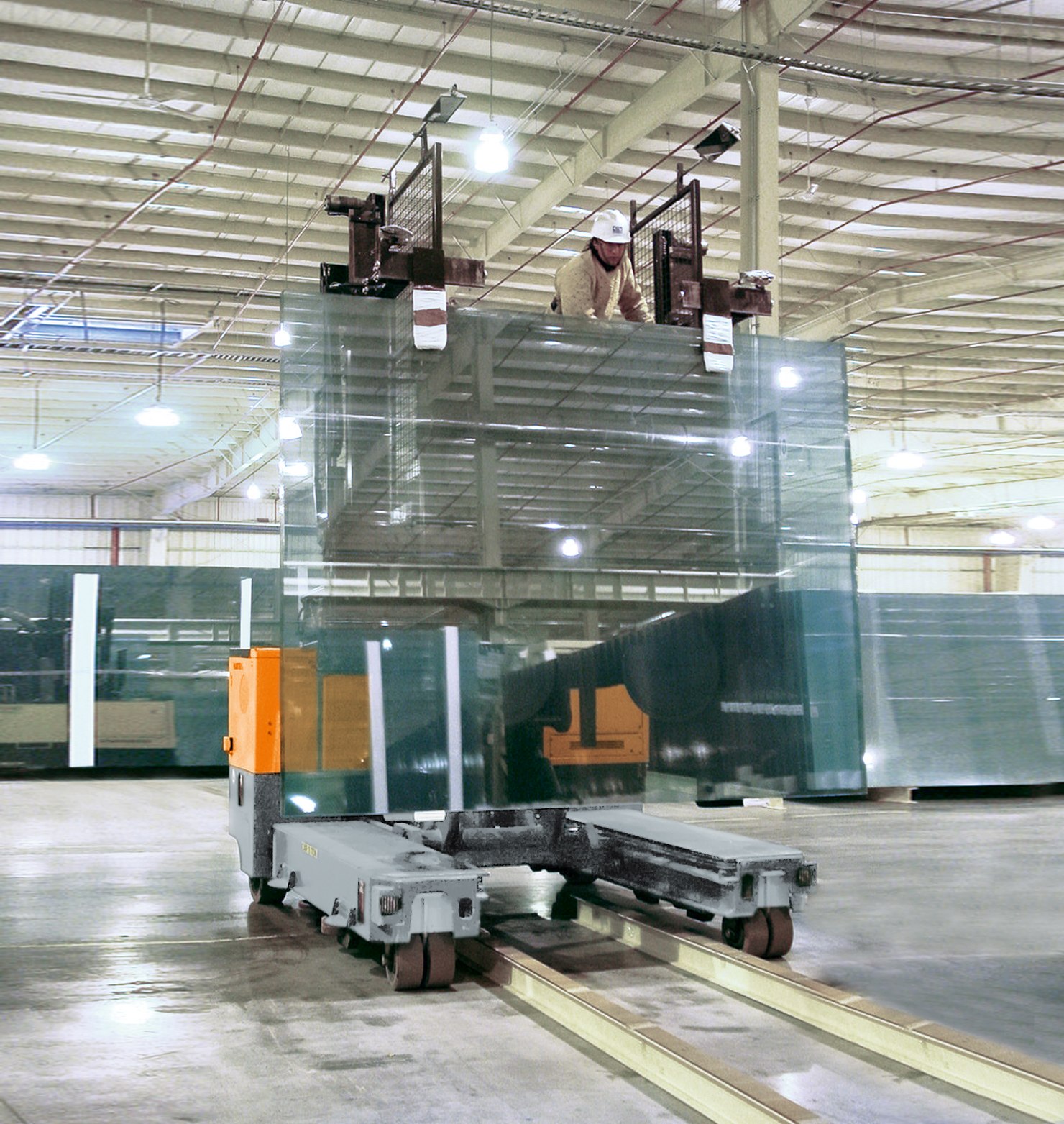 HUBTEX M90 multidirectional sideloader with lift stillage for glass transport in the hall