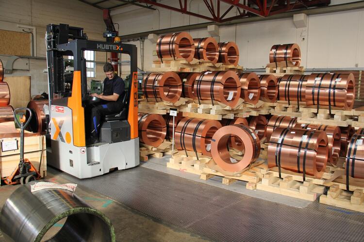 Reach trucks in narrow aisles with coils