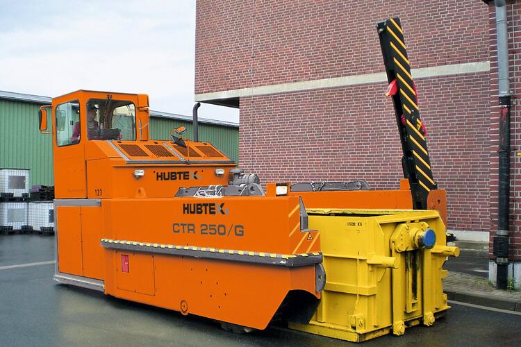 The vehicle lifting the container.