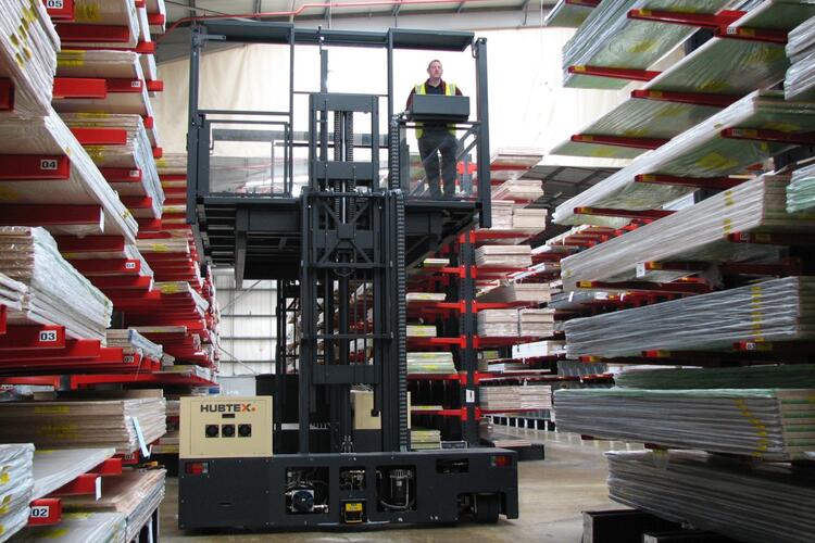 The HUBTEX two-side order picking platform entering a rack aisle