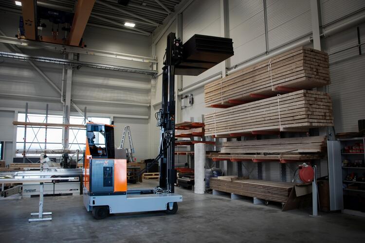 the HUBTEX MaxX electric multidirectional sideloader in use in the timber industry
