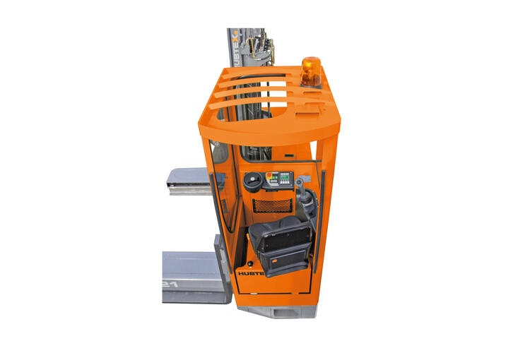 Diagonal seat cab with fixed seat