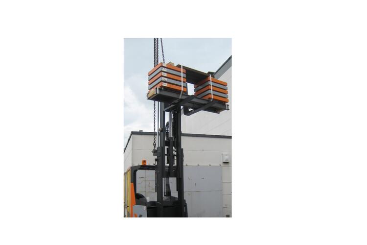The HUBTEX reach truck with raised load.