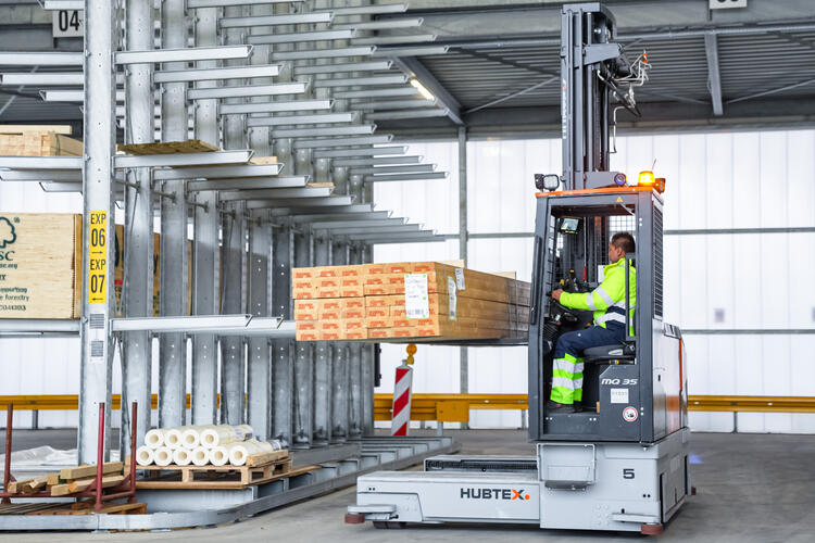 HUBTEX electric multidirectional forklift PHOENIX stores wood outdoors