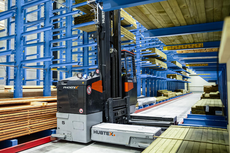 HUBTEX vehicle in use in a narrow aisle