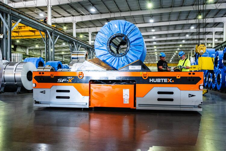 HUBTEX SFX 40 heavy-duty vehicle loaded with a coil