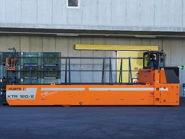 HUBTEX apple crate transporter lifting a load