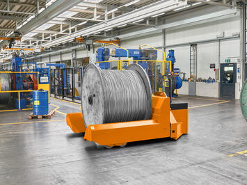 Heavy duty cable drum handling with a low lift truck