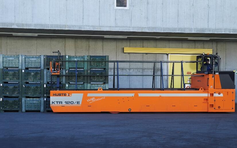 HUBTEX apple crate transporter lifting a load