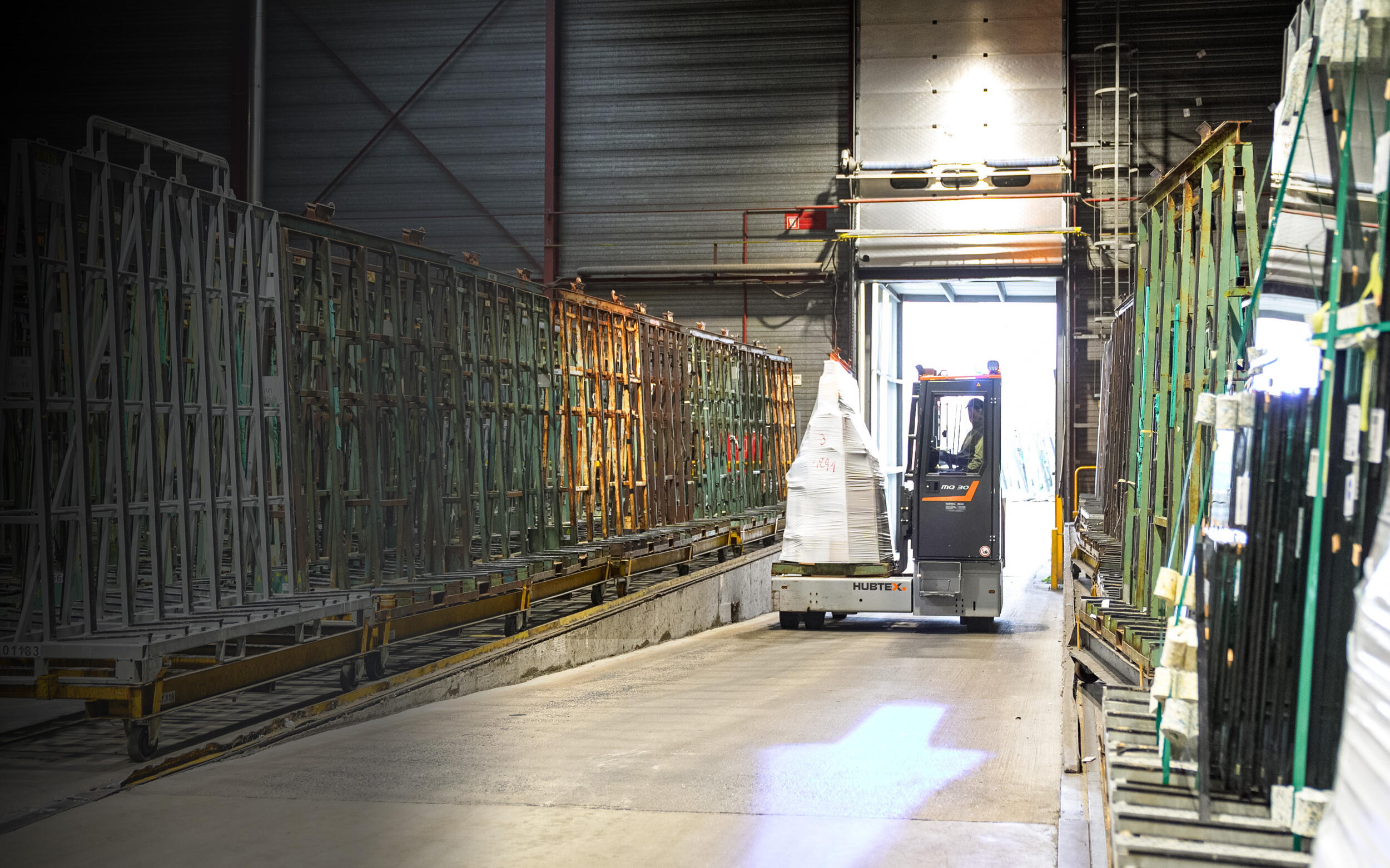 HUBTEX multi-directional sideloader transports goods between the warehouse and the yard.