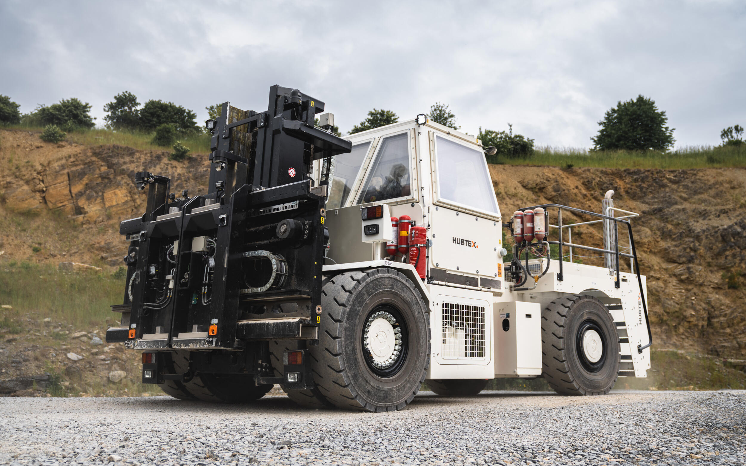 HUBTEX SF stacker for BGE, with a stone wall in the background