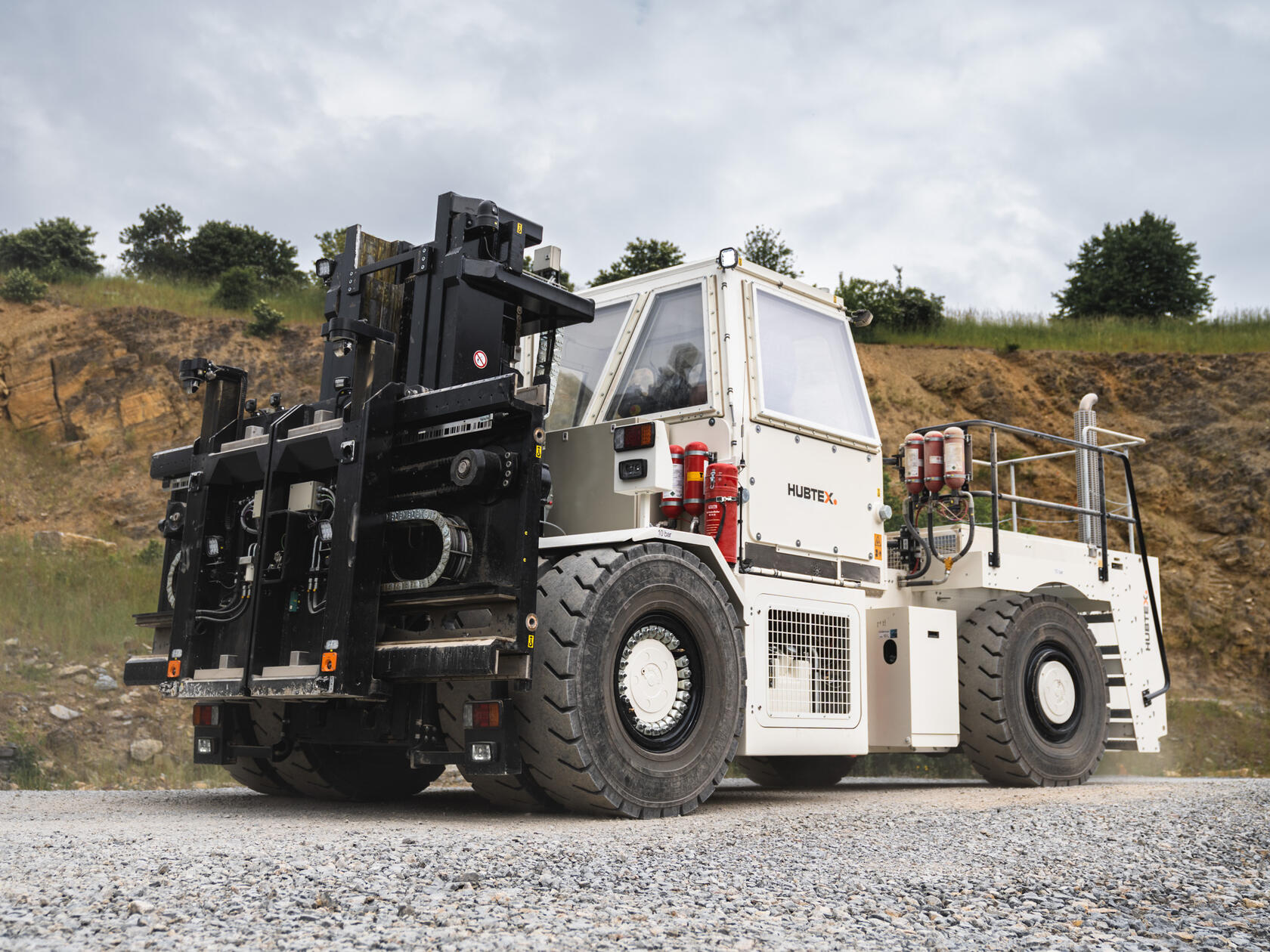 HUBTEX SF stacker for BGE, with a stone wall in the background