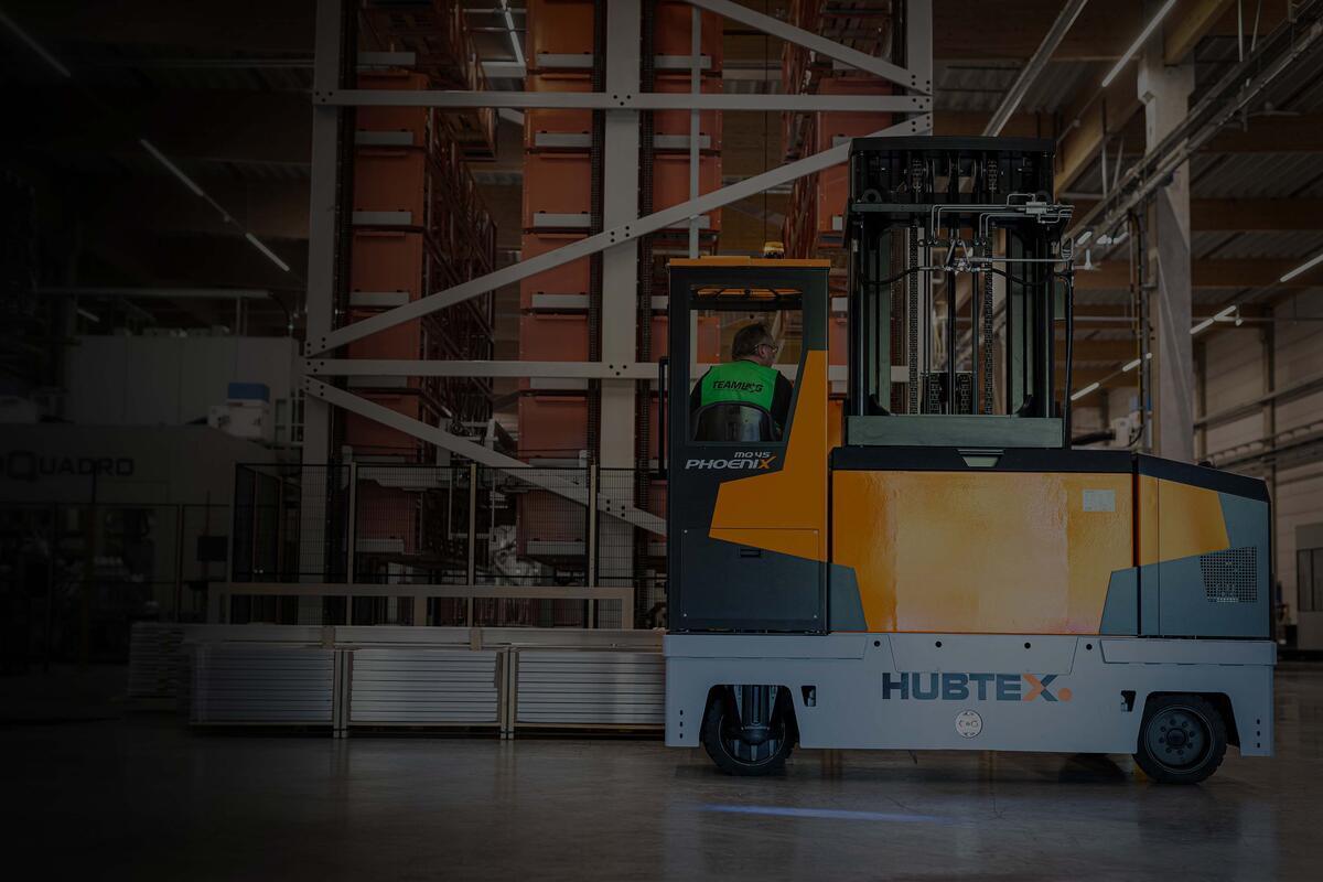 Side loader forklift handles long loads